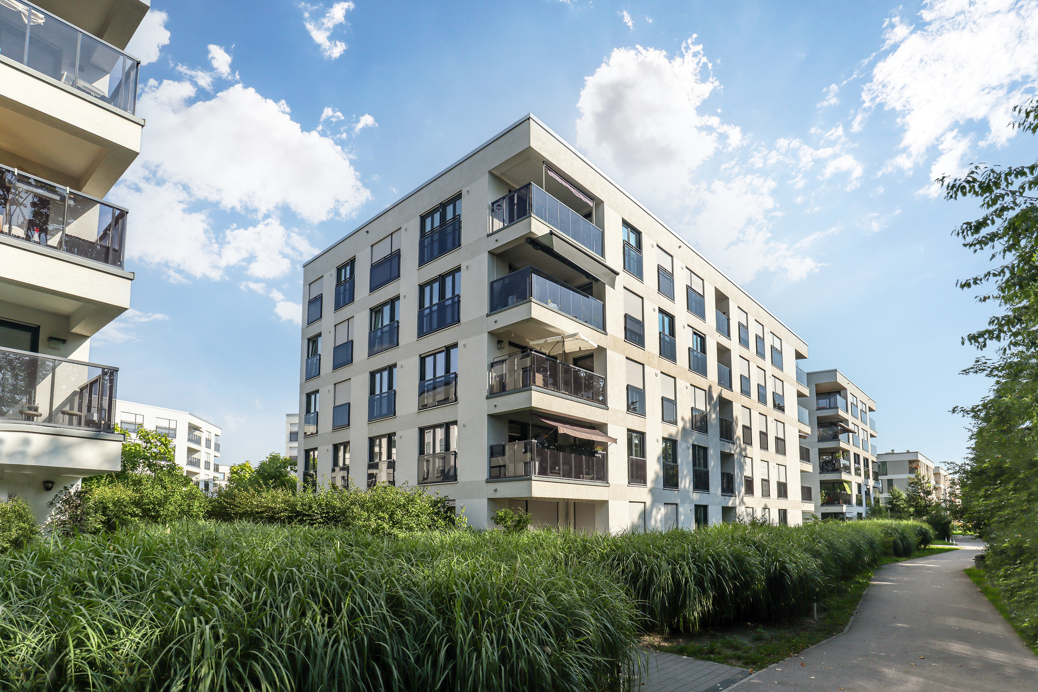 Residential area with ecological and sustainable green residential buildings, low-energy houses with modern apartments, new green urban landscape in the city